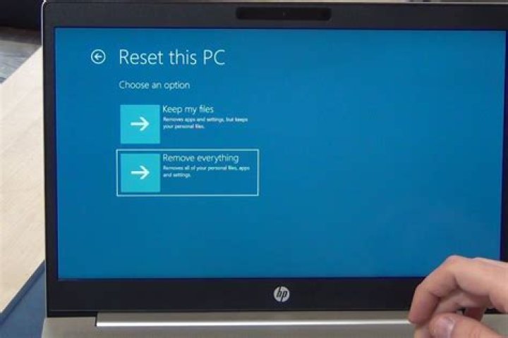 How do you manually reset a laptop?